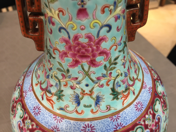 A Chinese porcelain turquoise ground famille rose &quot;Happiness&quot; vase, 20th C.