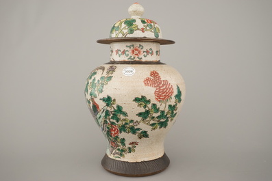 A Chinese porcelain famille verte Nanking vase and cover, 19th C.