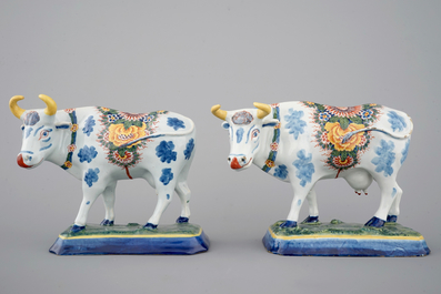 A pair of polychrome Dutch Delft models of cows, 18th C.