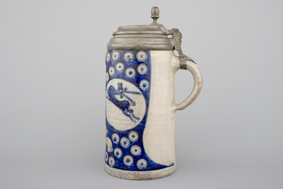 A tall Westerwald incised and pewter-mounted beer stein with deers and birds, 17th C.