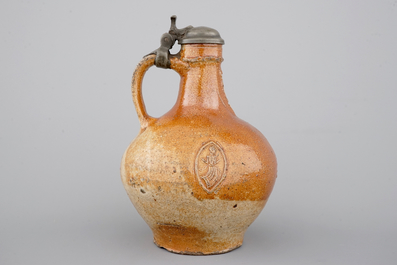 A fine beardman's or bellarmine jug with pewter cover, Raeren, late 16th C.
