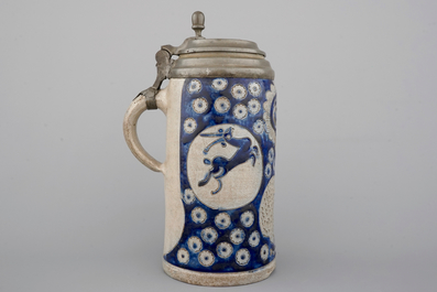 A tall Westerwald incised and pewter-mounted beer stein with deers and birds, 17th C.