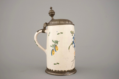 A beer stein with pewter lid and floral decoration, 18th C., Germany