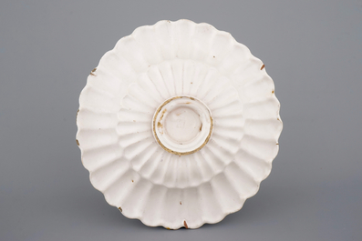 A good Dutch Delft monochrome white fluted charger, late 17th C.