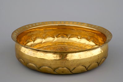 A good Nuremberg brass alms bowl showing Mary on the crescent moon, 16th C.