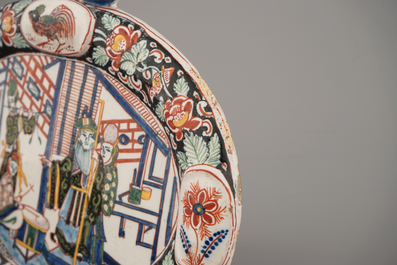 A Dutch Delft black-enhanced oval plaque with chinoiserie, ca. 1800