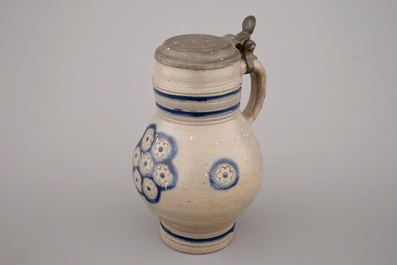 Two globular Westerwald stoneware jugs in blue and incised, one with pewter lid, 17th C.