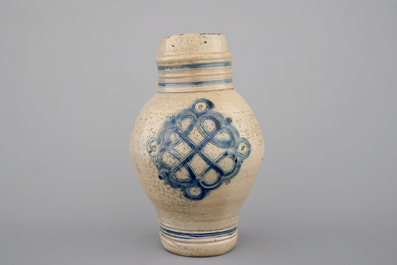 Two globular Westerwald stoneware jugs in blue and incised, one with pewter lid, 17th C.