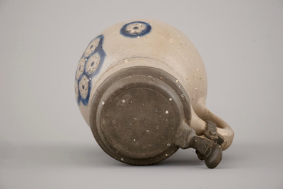 Two globular Westerwald stoneware jugs in blue and incised, one with pewter lid, 17th C.