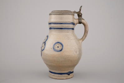 Two globular Westerwald stoneware jugs in blue and incised, one with pewter lid, 17th C.