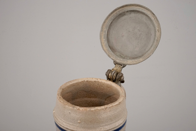 Two globular Westerwald stoneware jugs in blue and incised, one with pewter lid, 17th C.