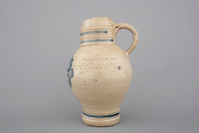 Two globular Westerwald stoneware jugs in blue and incised, one with pewter lid, 17th C.