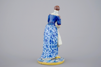 A tall polychrome Dutch Delft figure of a lady, ca. 1800