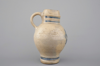 Two globular Westerwald stoneware jugs in blue and incised, one with pewter lid, 17th C.