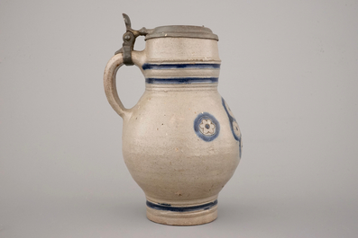 Two globular Westerwald stoneware jugs in blue and incised, one with pewter lid, 17th C.