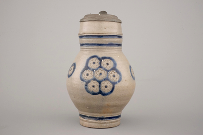 Two globular Westerwald stoneware jugs in blue and incised, one with pewter lid, 17th C.