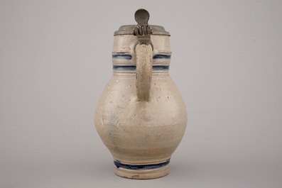 Two globular Westerwald stoneware jugs in blue and incised, one with pewter lid, 17th C.