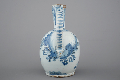 A Dutch Delft blue and white chinoiserie jug, 17th C.