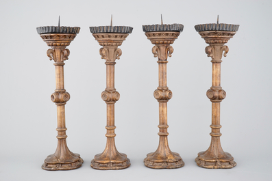 A set of 4 tall gothic revival wooden candlesticks, 19th C.