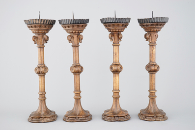 A set of 4 tall gothic revival wooden candlesticks, 19th C.