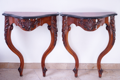 A fine pair of carved wood wall console tables, 19th C.