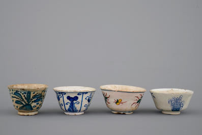 A set of 4 rare Dutch Delft tea cups and a saucer, 17/18th C.