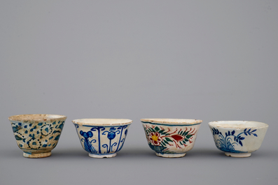 A set of 4 rare Dutch Delft tea cups and a saucer, 17/18th C.