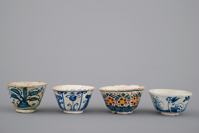A set of 4 rare Dutch Delft tea cups and a saucer, 17/18th C.