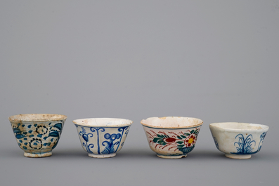 A set of 4 rare Dutch Delft tea cups and a saucer, 17/18th C.