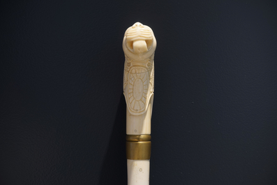 An Anglo-Indian ivory and brass walking stick or cane with a lion's head, 19th C.