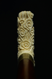 A Chinese carved ivory and wood walking stick or cane with a dragon's head, 19th C.