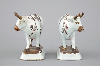 A pair of white Delft cold-painted cows, Dutch, 18th C.