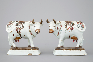 A pair of white Delft cold-painted cows, Dutch, 18th C.