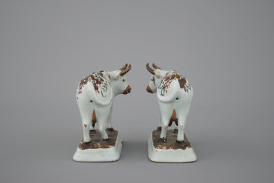 A pair of white Delft cold-painted cows, Dutch, 18th C.