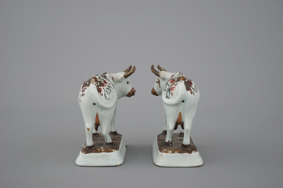 A pair of white Delft cold-painted cows, Dutch, 18th C.