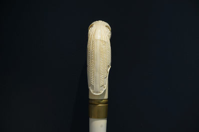An Anglo-Indian ivory and brass walking stick or cane with a lion's head, 19th C.