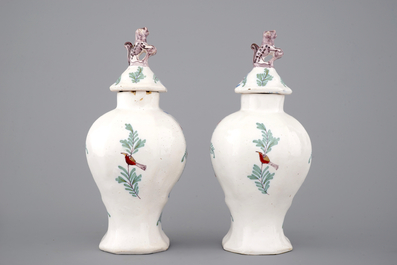A pair of polychrome Dutch Delft vases and a dish, 18/19th C.
