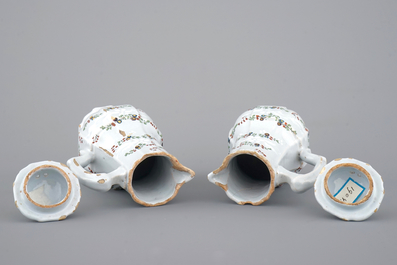 A fine pair of polychrome French faience jugs and cover, 18th C.