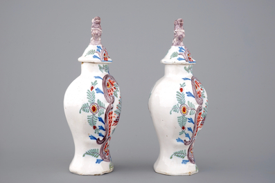 A pair of polychrome Dutch Delft vases and a dish, 18/19th C.