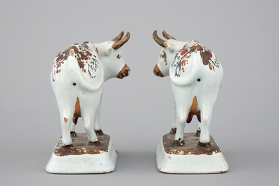 A pair of white Delft cold-painted cows, Dutch, 18th C.