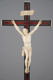 Two carved ivory corpus christi, mounted on ebony and tortoise shell crucifix, 18/19th C.