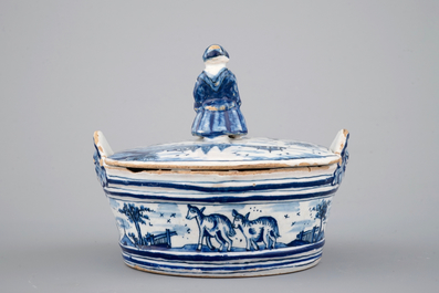 A blue and white Dutch Delftware butter tub with a lady-shaped finial, 18th C.