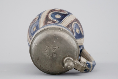 A Westerwald pewter-mounted jug in manganese and blue, 17th C.