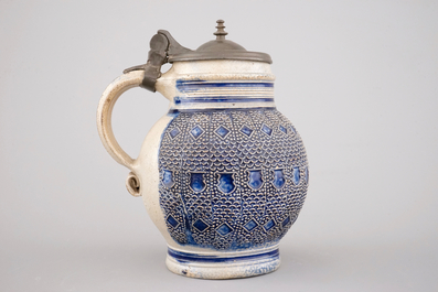 A globular Westerwald stoneware jug with applied decoration, 17th C.