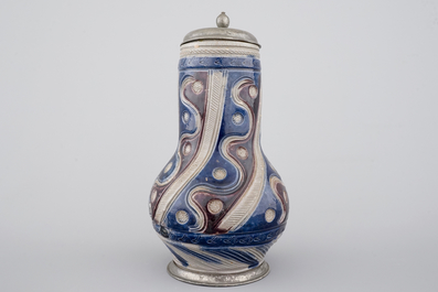 A Westerwald pewter-mounted jug in manganese and blue, 17th C.