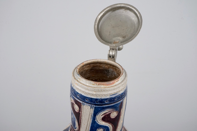 A Westerwald pewter-mounted jug in manganese and blue, 17th C.