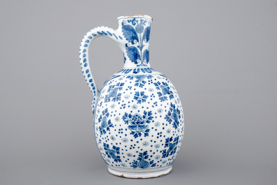A large Dutch Delft blue and white jug, 18th C.