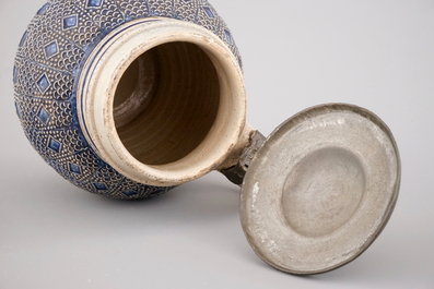 A globular Westerwald stoneware jug with applied decoration, 17th C.