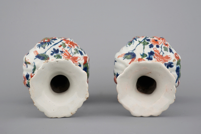 A pair of Dutch Delft ribbed garlick neck vases in cashemire palette, ca. 1700