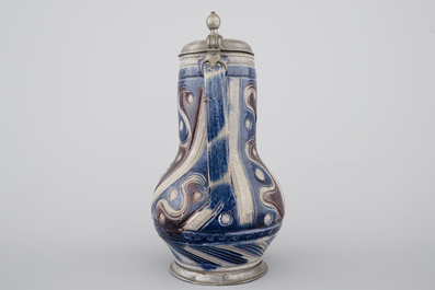 A Westerwald pewter-mounted jug in manganese and blue, 17th C.